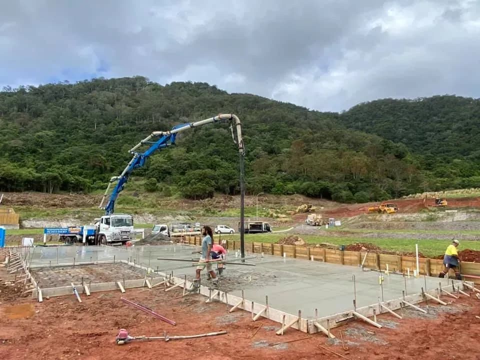 Commercial concrete pour underway with a boom pump — Far Northern Concrete Pumping, servicing Smithfield QLD