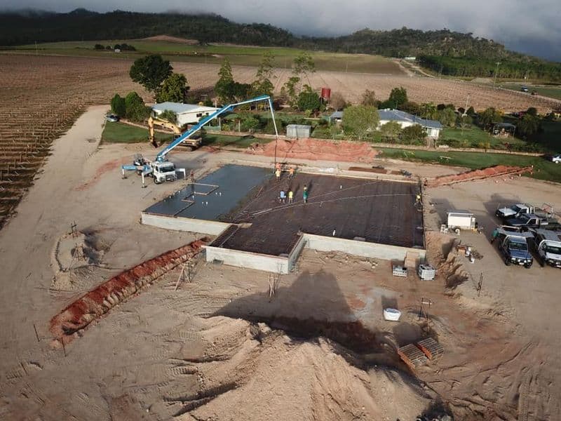 Construction Site With a Concrete Slab Being Poured, Featuring a Pump Truck — Far Northern Concrete Pumping, servicing Trinity Park QLD