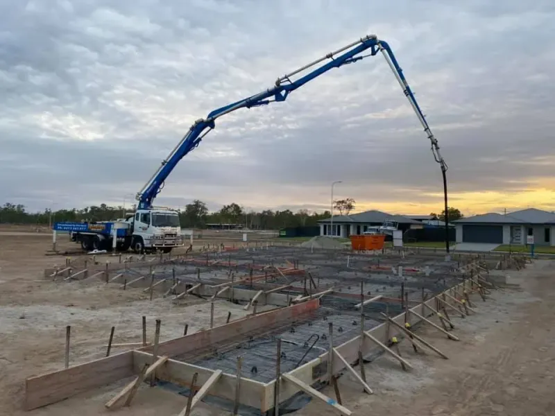 Concrete pump truck pouring concrete into a prepared foundation — Far Northern Concrete Pumping, servicing Smithfield QLD