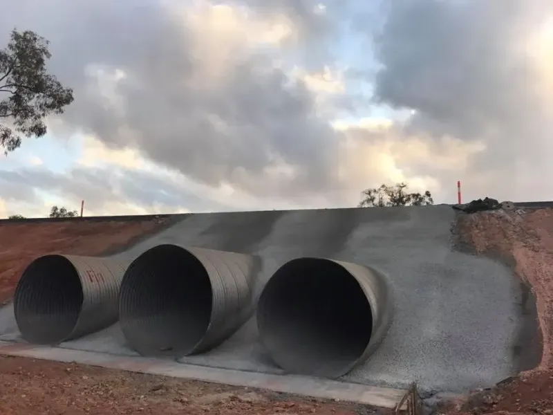 Three Large, Round Culverts Under a Gray Concrete Embankment — Far Northern Concrete Pumping, servicing Mount Sheridan QLD