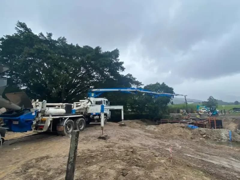 Concrete Pump Truck Pouring Concrete at a Construction Site — Far Northern Concrete Pumping, servicing Innisfail QLD