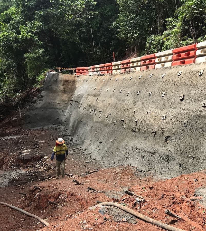 Construction Worker Standing Near a Retaining Wall — Far Northern Concrete Pumping, servicing Mount Sheridan QLD