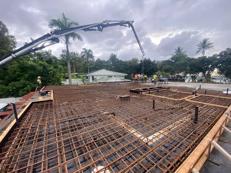 Concrete Being Poured on Rebar Grid, Construction Site — Far Northern Concrete Pumping, servicing Innisfail QLD