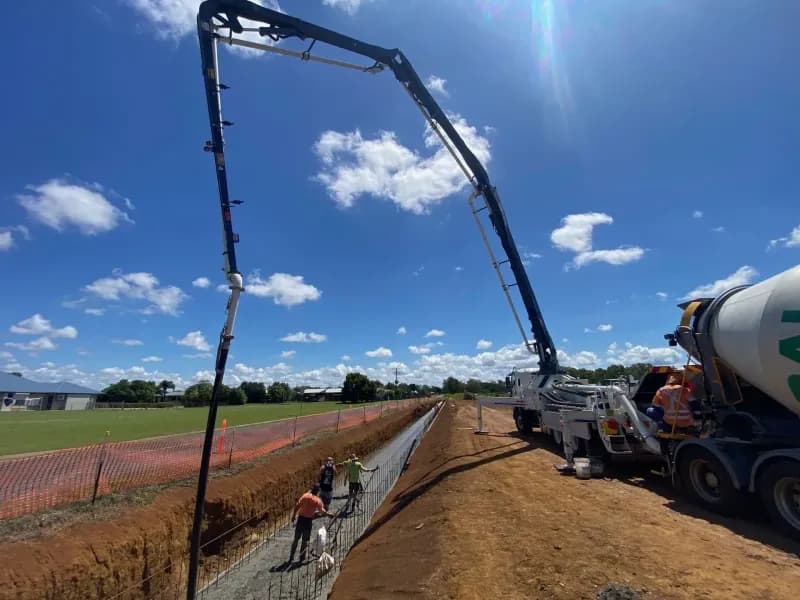 Concrete Pouring Construction Site With Truck and Boom Arm — Far Northern Concrete Pumping, servicing Gordonvale QLD