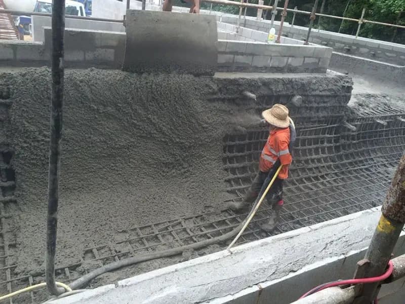 Construction Worker Leveling Wet Concrete — Far Northern Concrete Pumping in Atherton, QLD